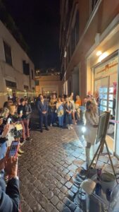 Street blocked by spectators watching VIOLINO diVINO art performance in Rome